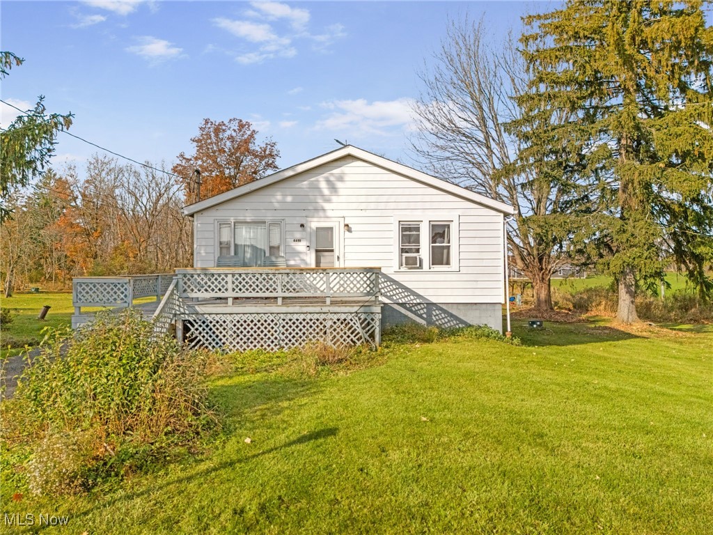 4491 Rock Spring Road Ravenna, OH 44266 - Photo 3 of 21 Back of house featuring a yard and a deck