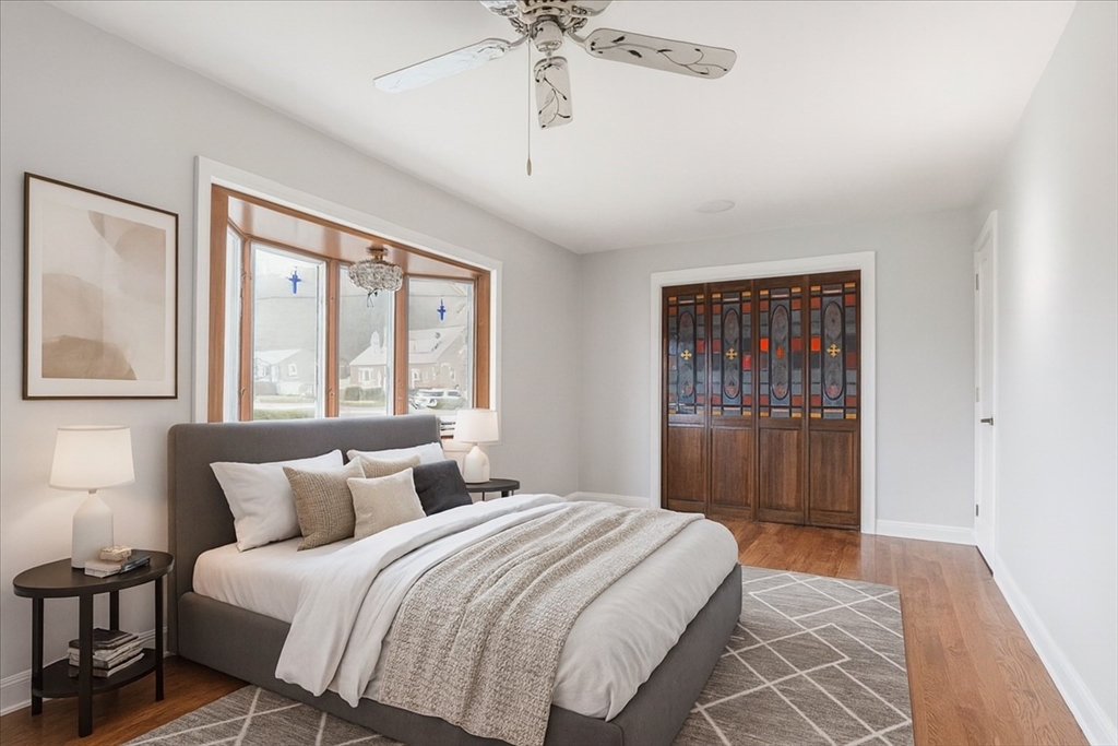 109 Merryknoll Road Weymouth, MA 02191 - Photo 14 of 41 a bedroom with a large bed and a window