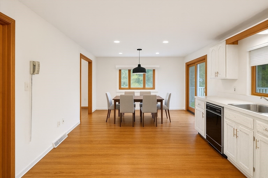 109 Merryknoll Road Weymouth, MA 02191 - Photo 18 of 41 a view of a dining room with furniture and a kitchen