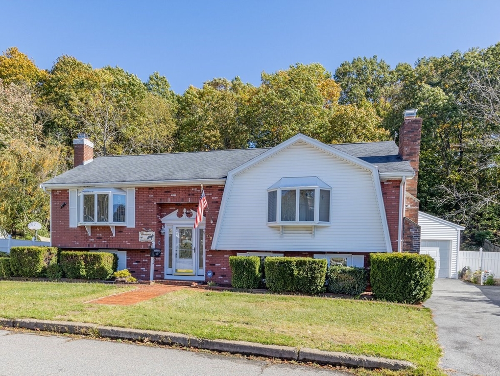 109 Merryknoll Road Weymouth, MA 02191 - Photo 2 of 41 a front view of a house with a yard and garage