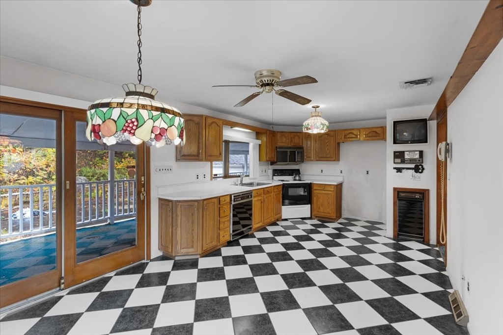 109 Merryknoll Road Weymouth, MA 02191 - Photo 21 of 41 a kitchen with stainless steel appliances granite countertop a sink a counter top space and a window