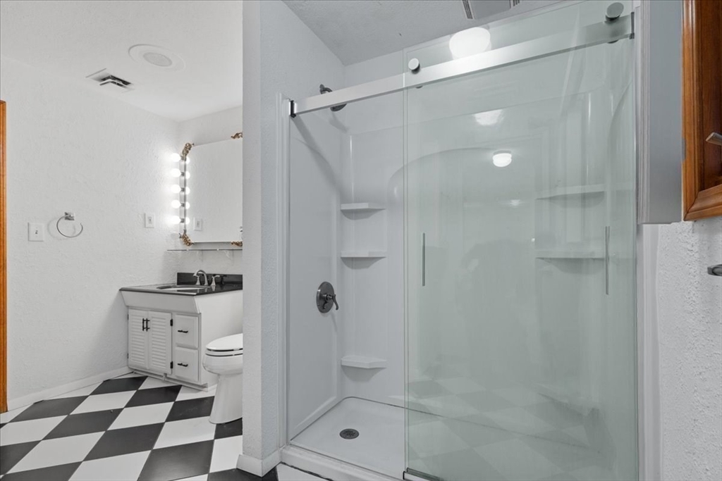 109 Merryknoll Road Weymouth, MA 02191 - Photo 24 of 41 a bathroom with a shower a mirror and a sink