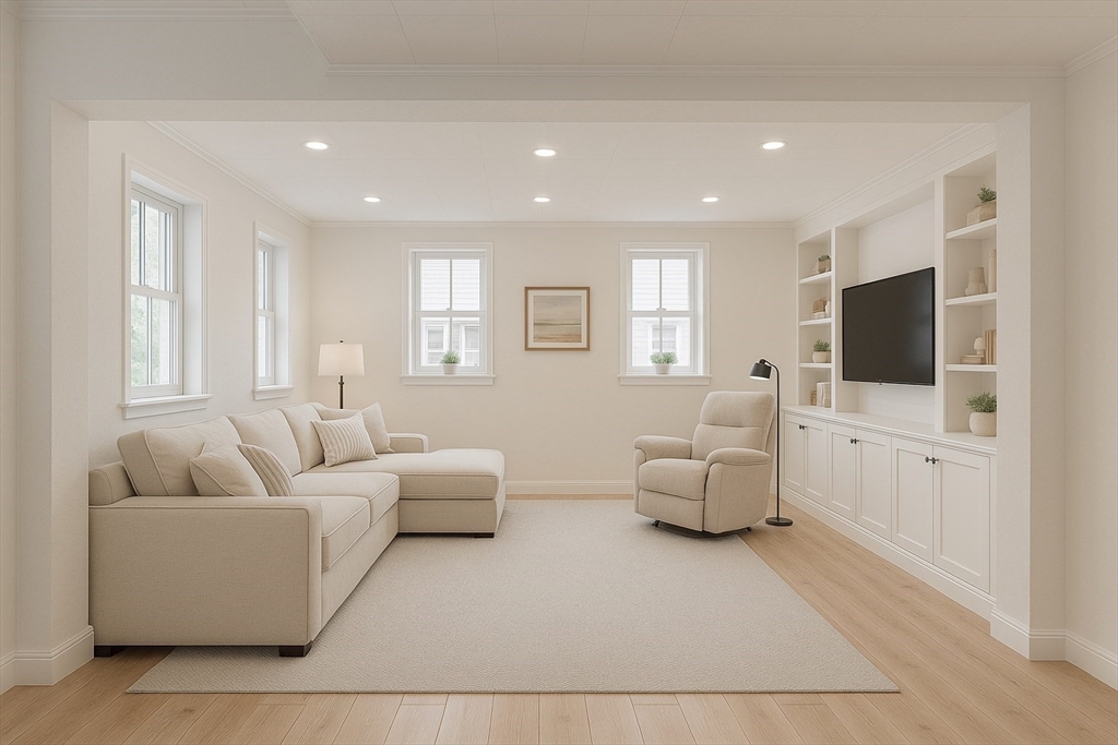 109 Merryknoll Road Weymouth, MA 02191 - Photo 30 of 41 a living room with furniture and a flat screen tv