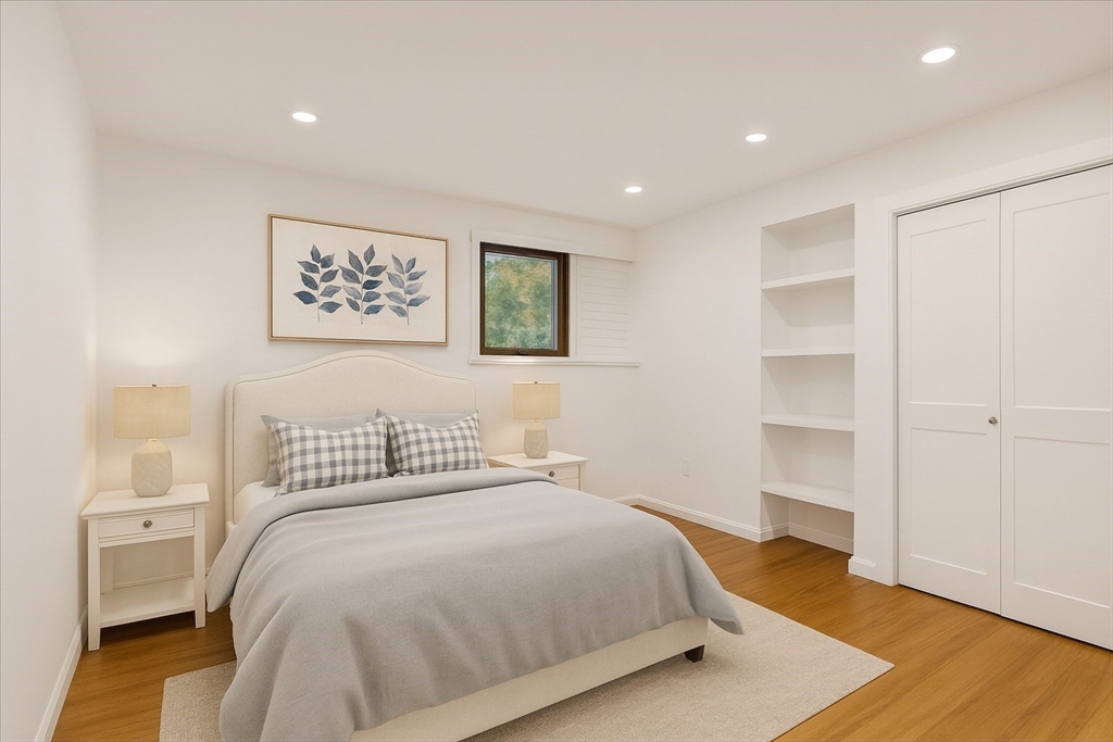 109 Merryknoll Road Weymouth, MA 02191 - Photo 32 of 41 a bedroom with a bed and a painting