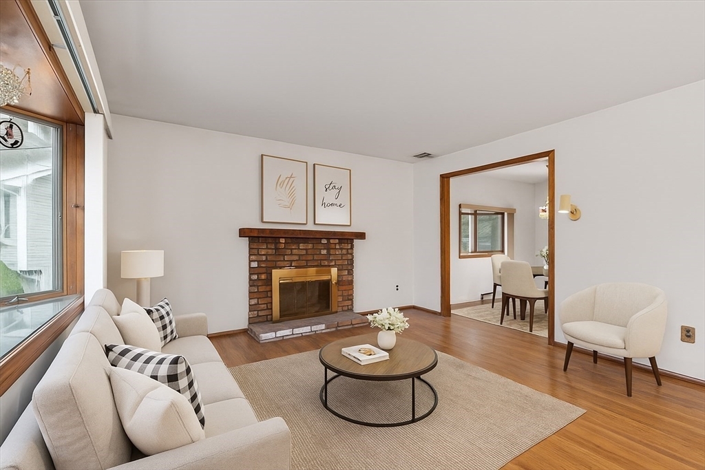 109 Merryknoll Road Weymouth, MA 02191 - Photo 6 of 41 a living room with furniture and a fireplace