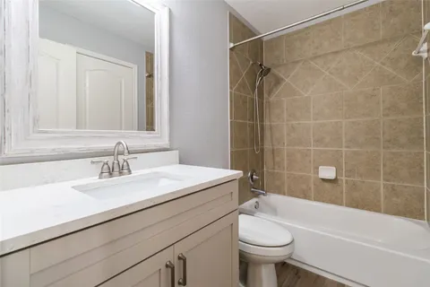 a bathroom with a sink a toilet and a bathtub