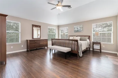 a bedroom with furniture and windows