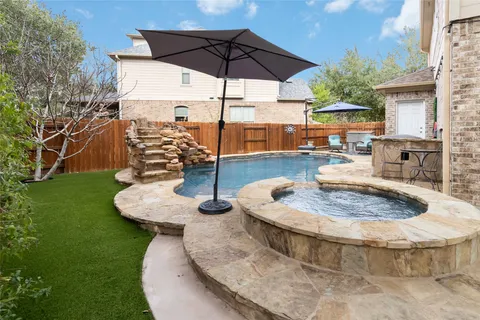 a view of a swimming pool with a patio