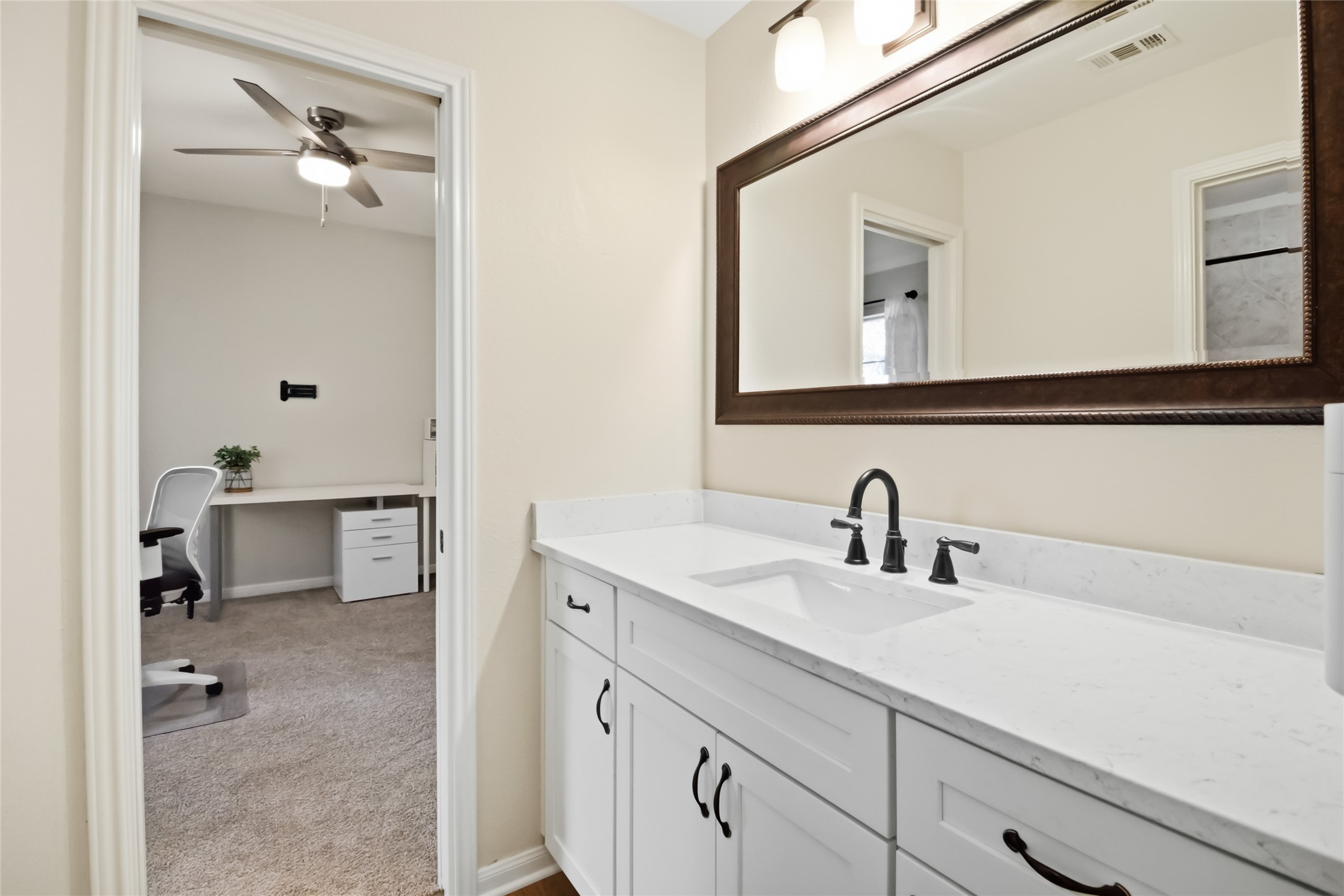 4525 Three Arrows Court Cedar Park, TX 78613 - Photo 32 of 32 Bathroom featuring vanity, light carpet, and ceiling fan
