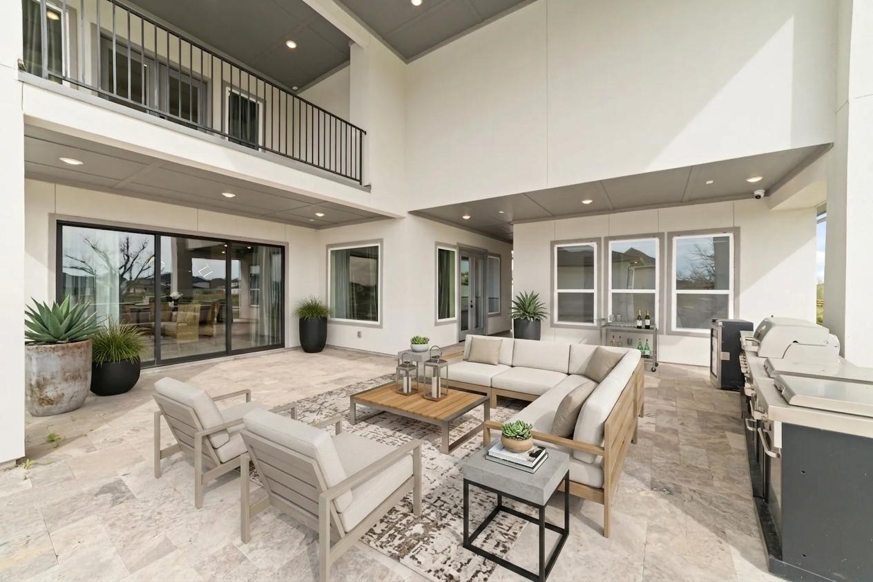 29627 Cir S Rnch Trail Fulshear, TX 77406 - Photo 36 of 50 Slide open the glass doors and the entire home expands outdoors. Whether it's dinner under the covered patio, weekends by the pool, or evenings spent watching the sun set over the lake, this is where memories are made.