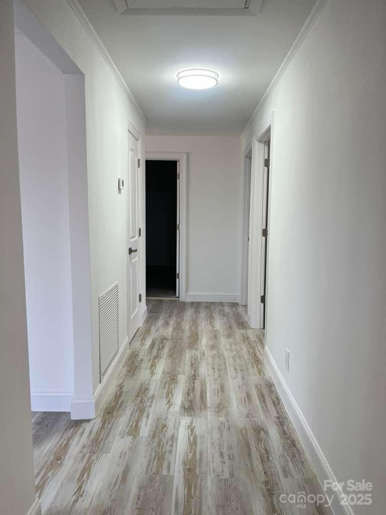 1073 Springdale Drive Maiden, NC 28650 - Photo 11 of 33 a view of hallway with wooden floor