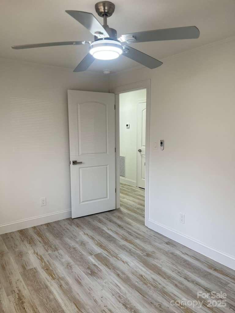 1073 Springdale Drive Maiden, NC 28650 - Photo 17 of 33 a view of empty room with wooden floor