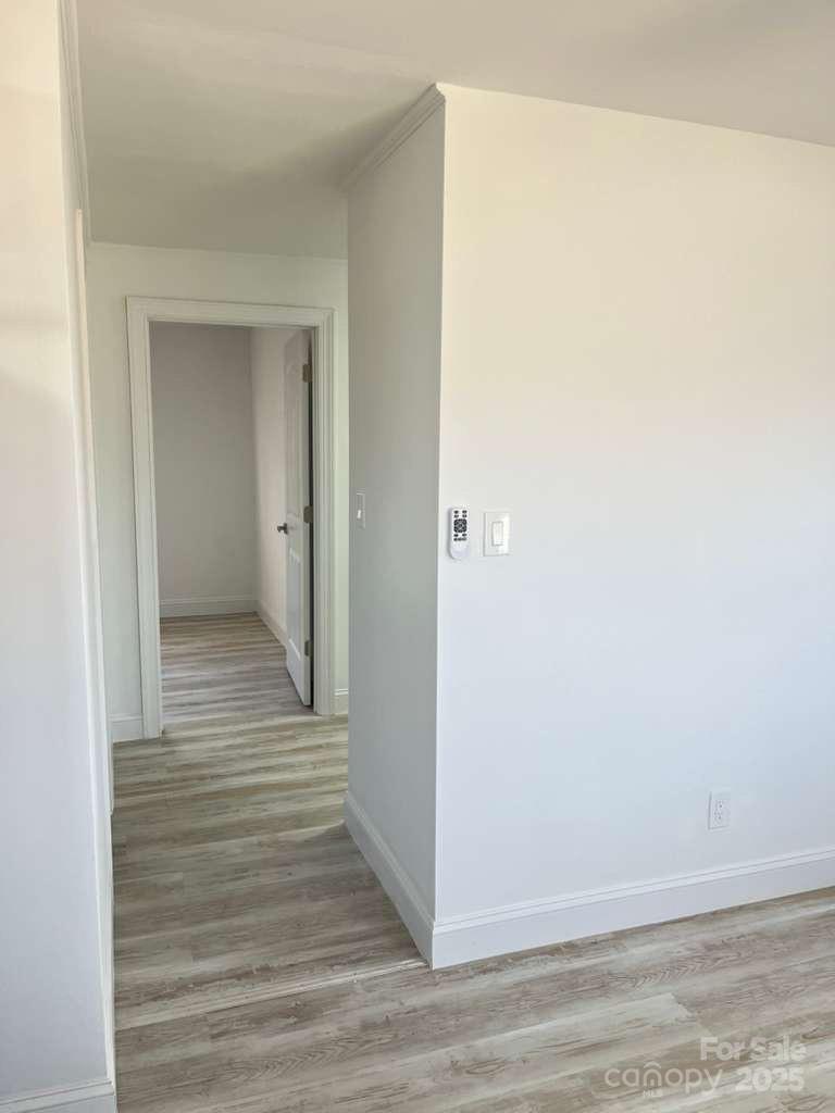 1073 Springdale Drive Maiden, NC 28650 - Photo 18 of 33 a view of a hallway with wooden floor