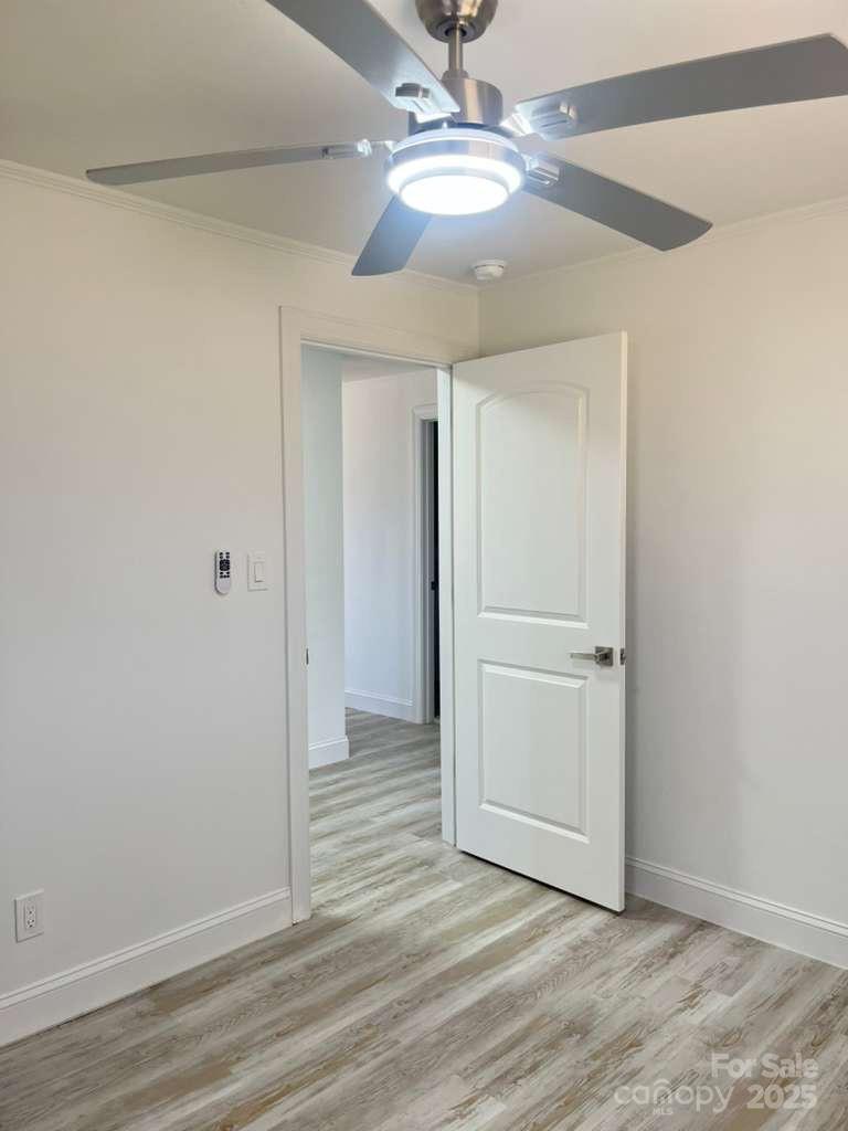 1073 Springdale Drive Maiden, NC 28650 - Photo 22 of 33 a view of an empty room with wooden floor