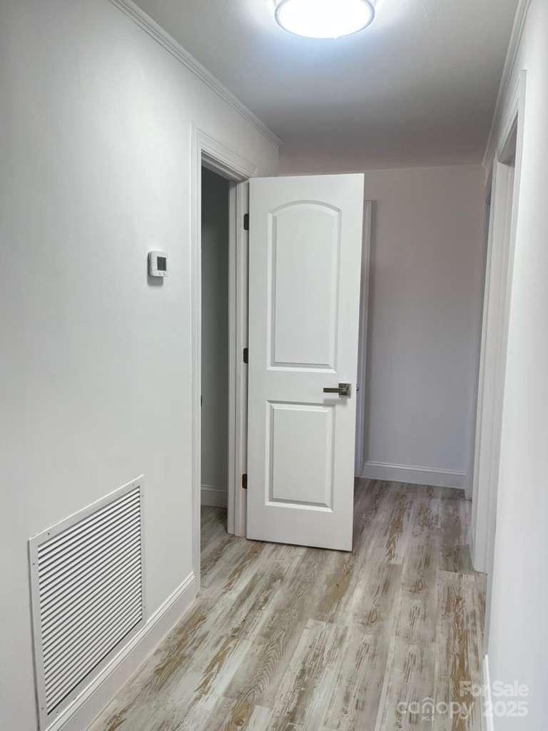 1073 Springdale Drive Maiden, NC 28650 - Photo 26 of 33 a view of empty room with wooden floor