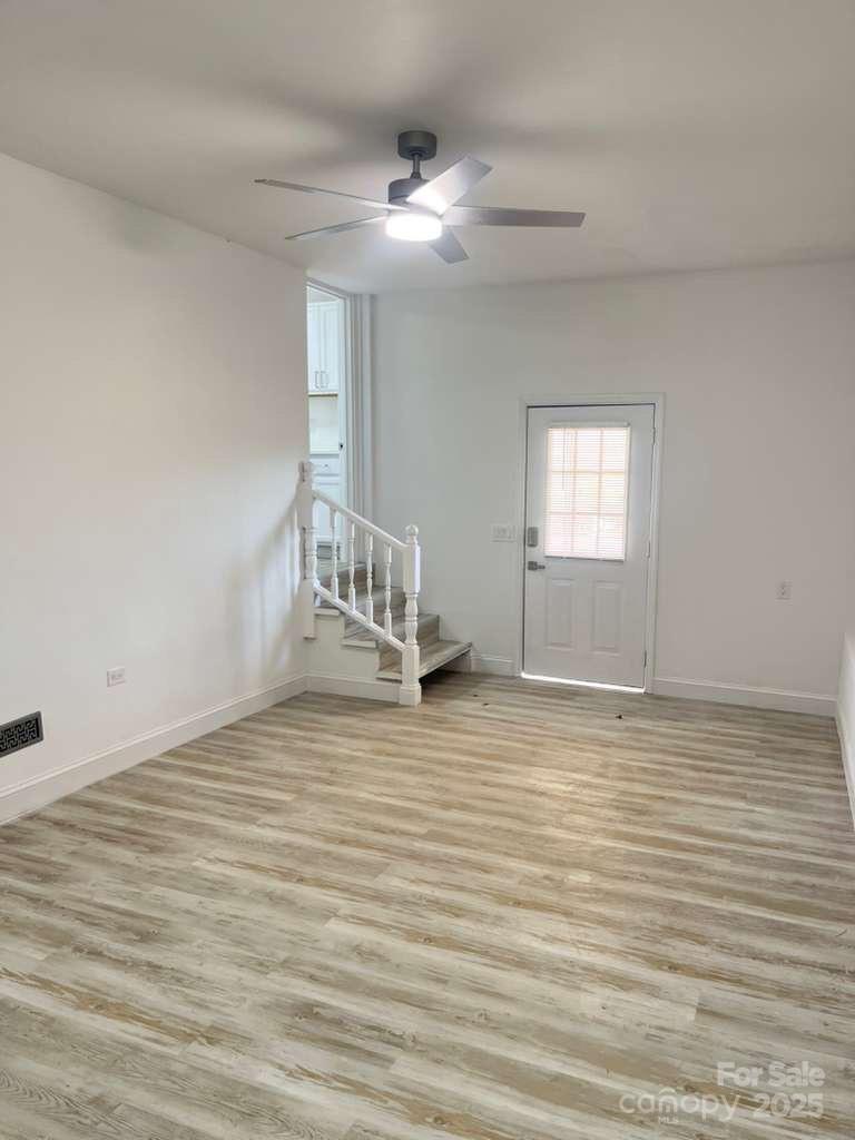 1073 Springdale Drive Maiden, NC 28650 - Photo 27 of 33 a view of empty room with wooden floor and fan