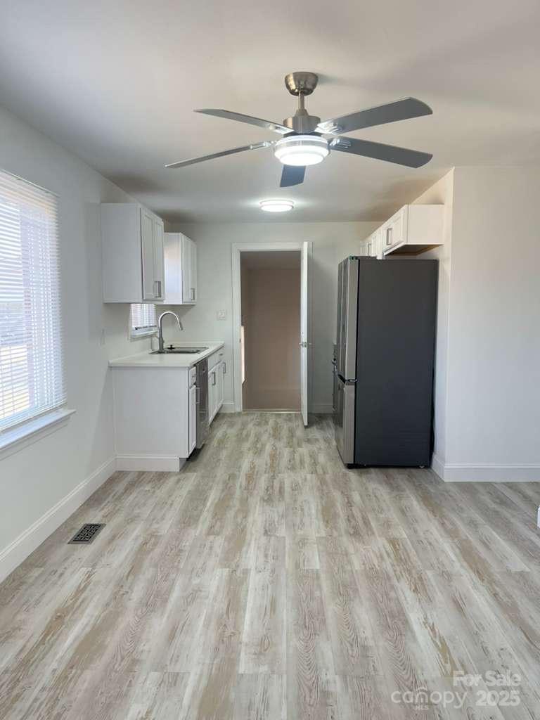 1073 Springdale Drive Maiden, NC 28650 - Photo 7 of 33 a view of a kitchen with a sink and cabinet wooden floor