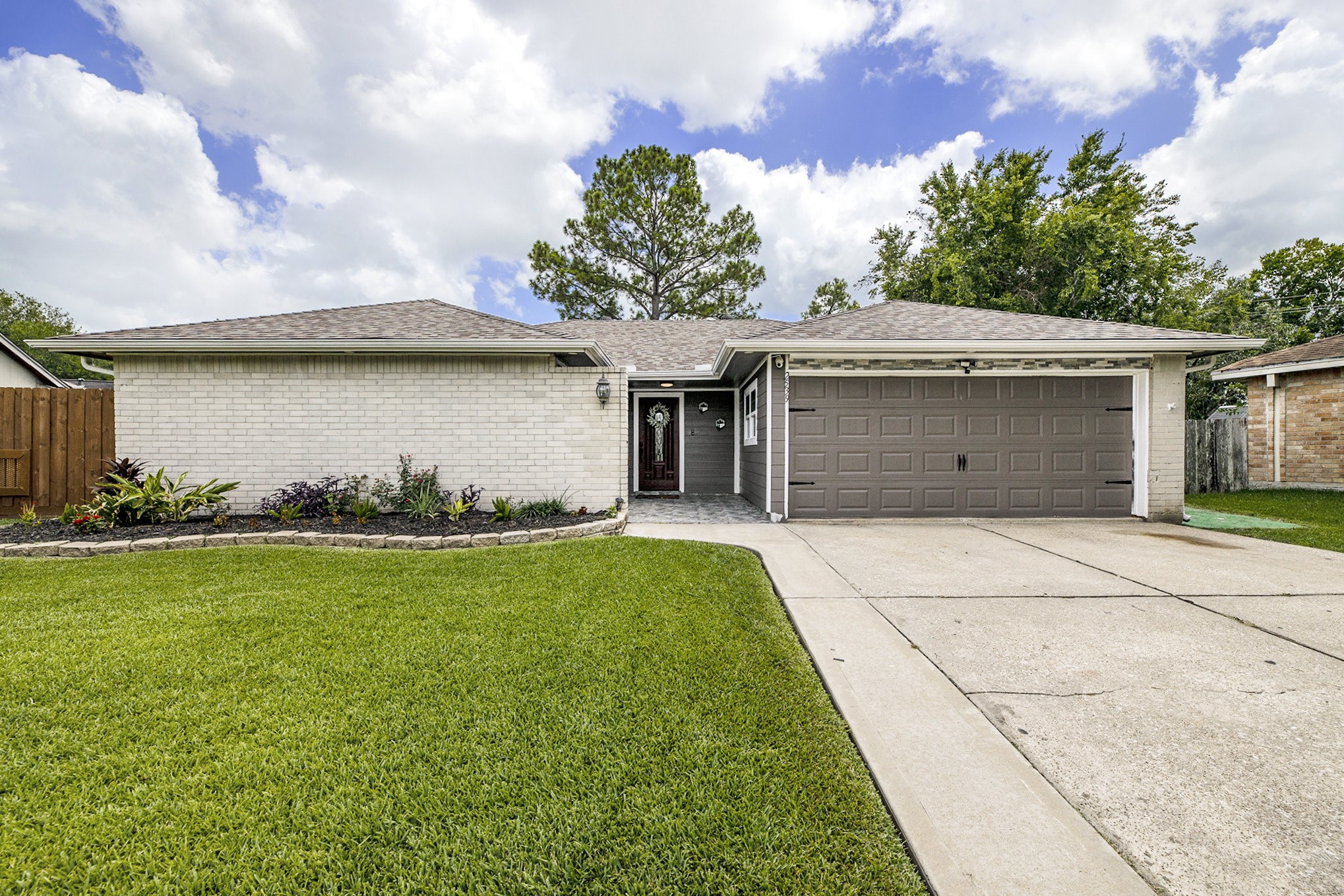 a front view of a house with garden