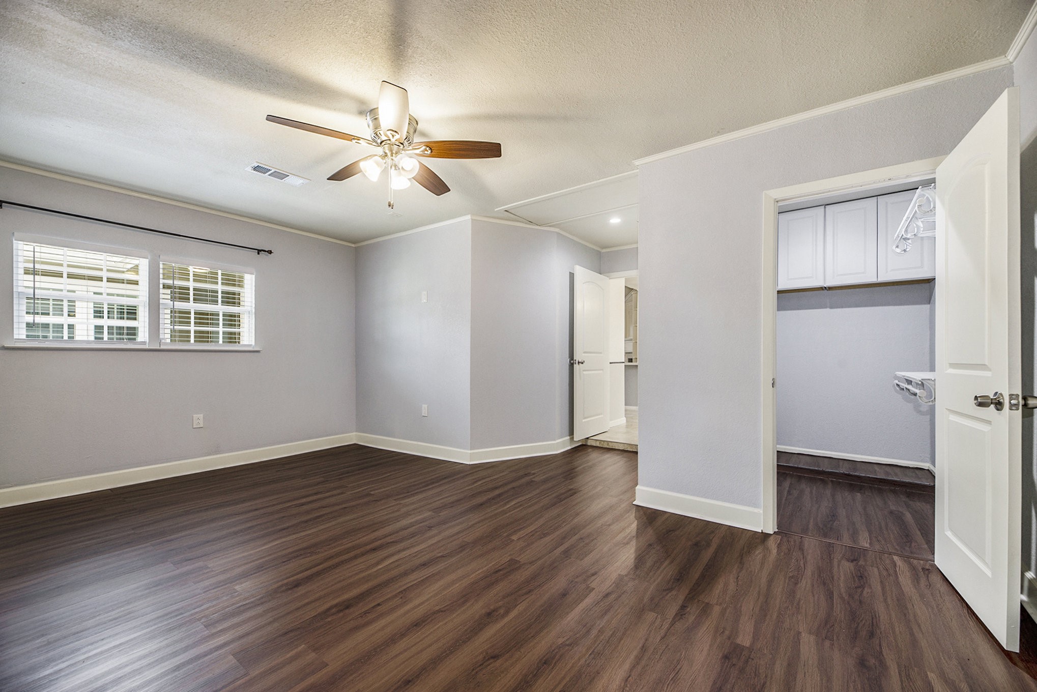 2539 Cobblers Way Friendswood, TX 77546 - Photo 11 of 19 a view of an empty room with wooden floor and a window