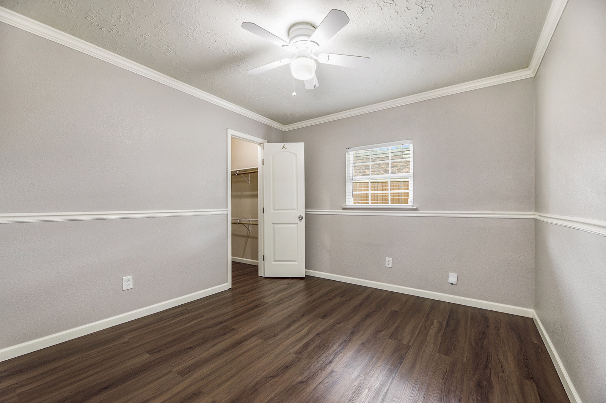 2539 Cobblers Way Friendswood, TX 77546 - Photo 15 of 19 an empty room with wooden floor and windows