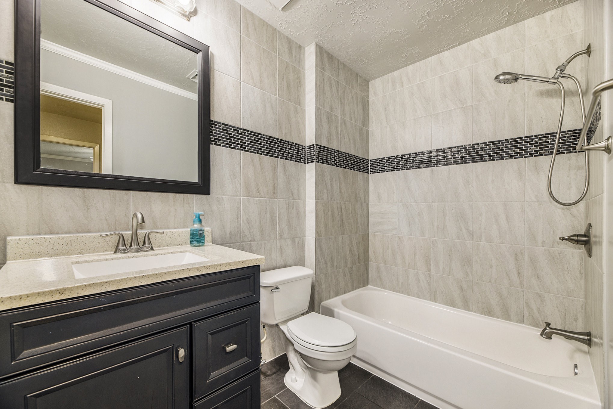 2539 Cobblers Way Friendswood, TX 77546 - Photo 16 of 19 a bathroom with a sink a toilet and a bathtub