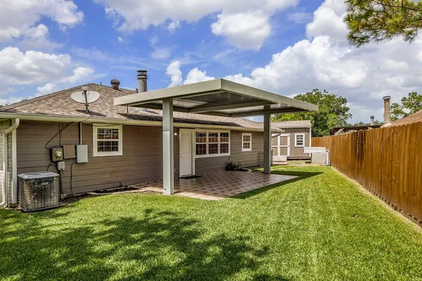 a view of a house with a yard and plants