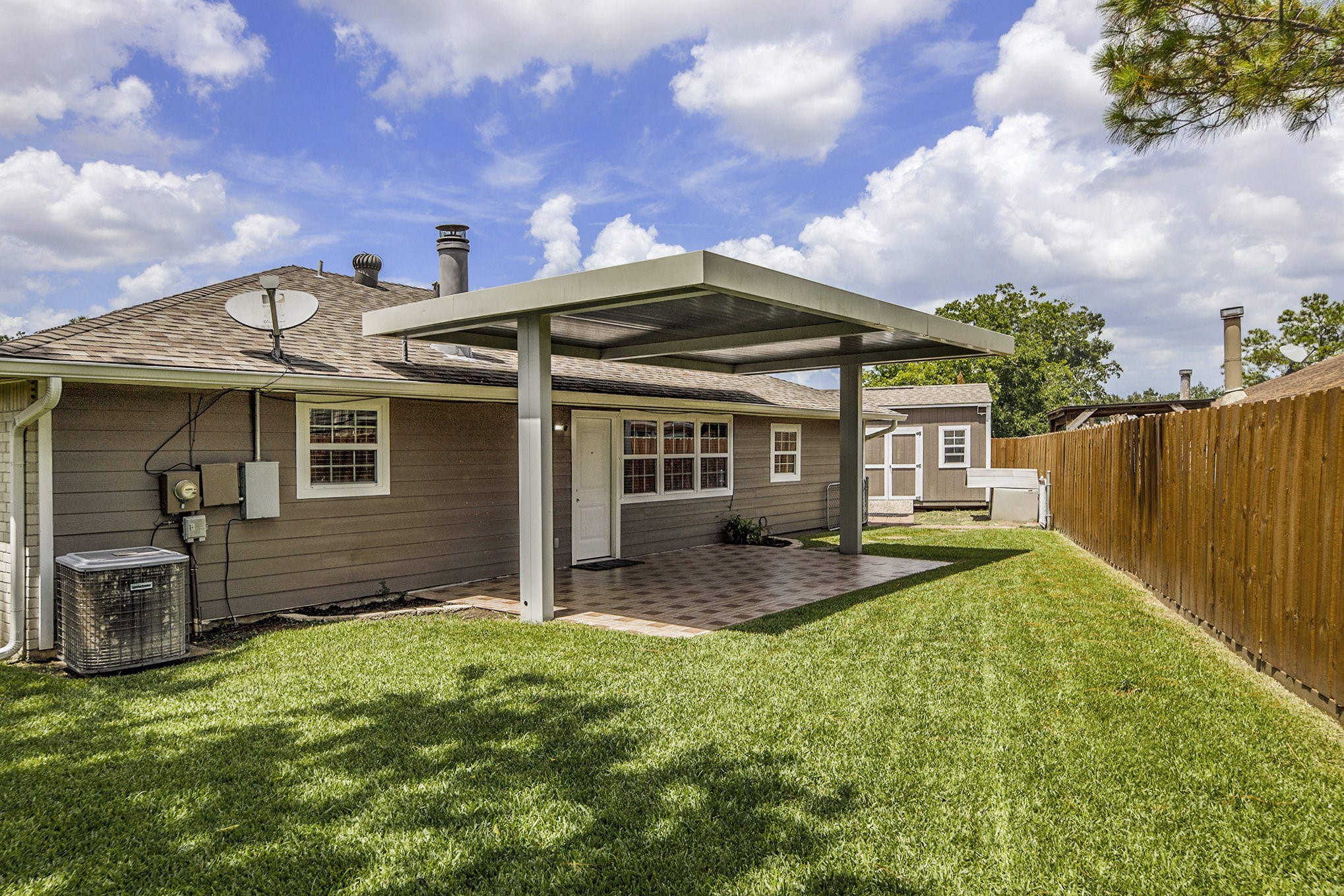 2539 Cobblers Way Friendswood, TX 77546 - Photo 18 of 19 a view of a house with backyard porch and wooden fence