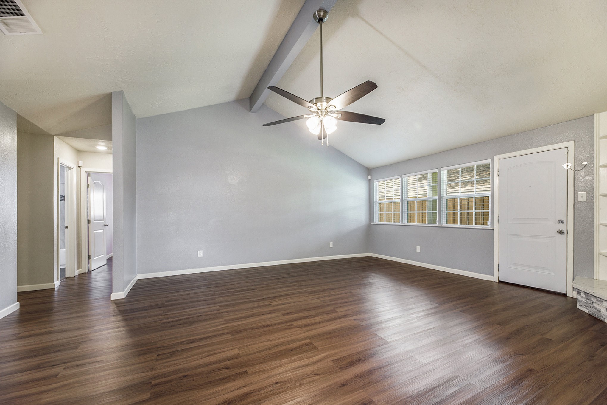 2539 Cobblers Way Friendswood, TX 77546 - Photo 5 of 19 an empty room with wooden floor and windows