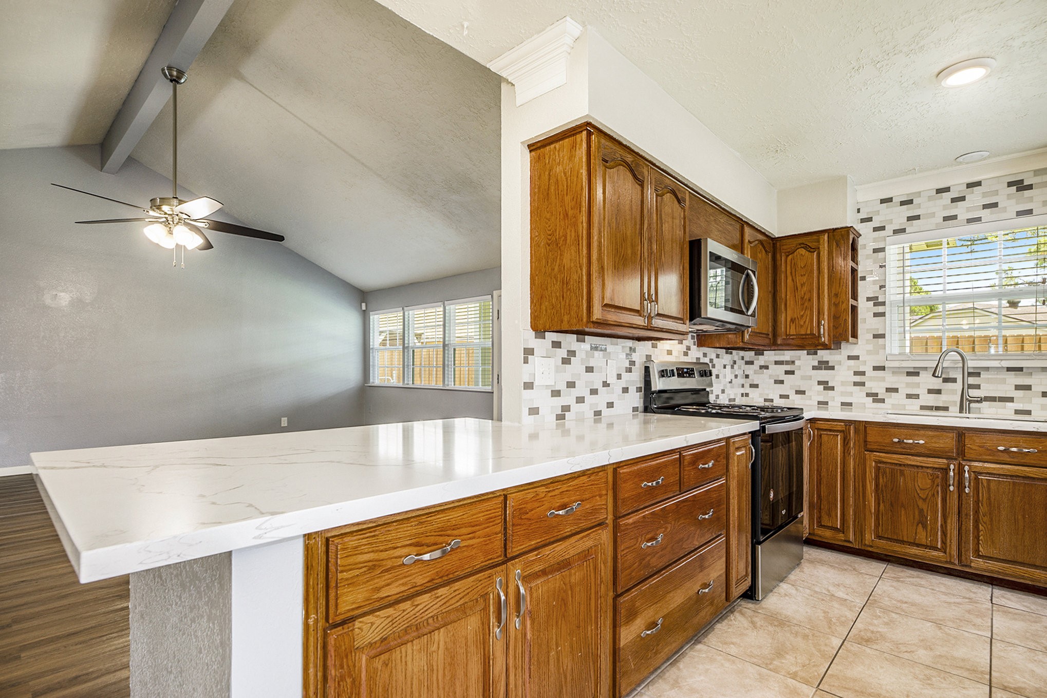 2539 Cobblers Way Friendswood, TX 77546 - Photo 8 of 19 a kitchen with stainless steel appliances granite countertop a sink dishwasher stove and cabinets