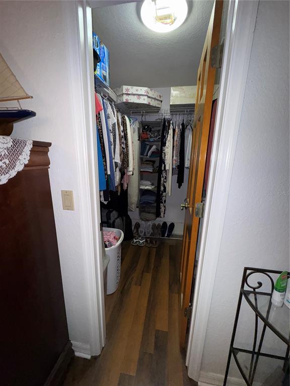 2134 R E Byrd Road Frostproof, FL 33843 - Photo 19 of 54 a view of walk in closet with clothes and shoes