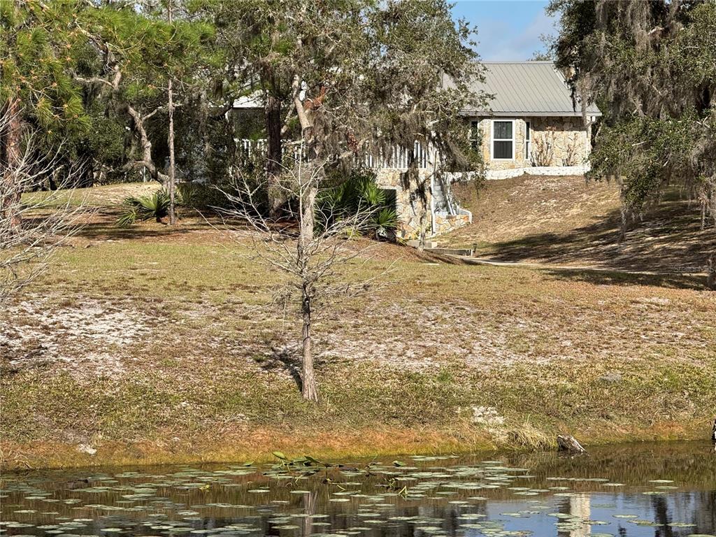 2134 R E Byrd Road Frostproof, FL 33843 - Photo 2 of 54 a view of a house with a yard
