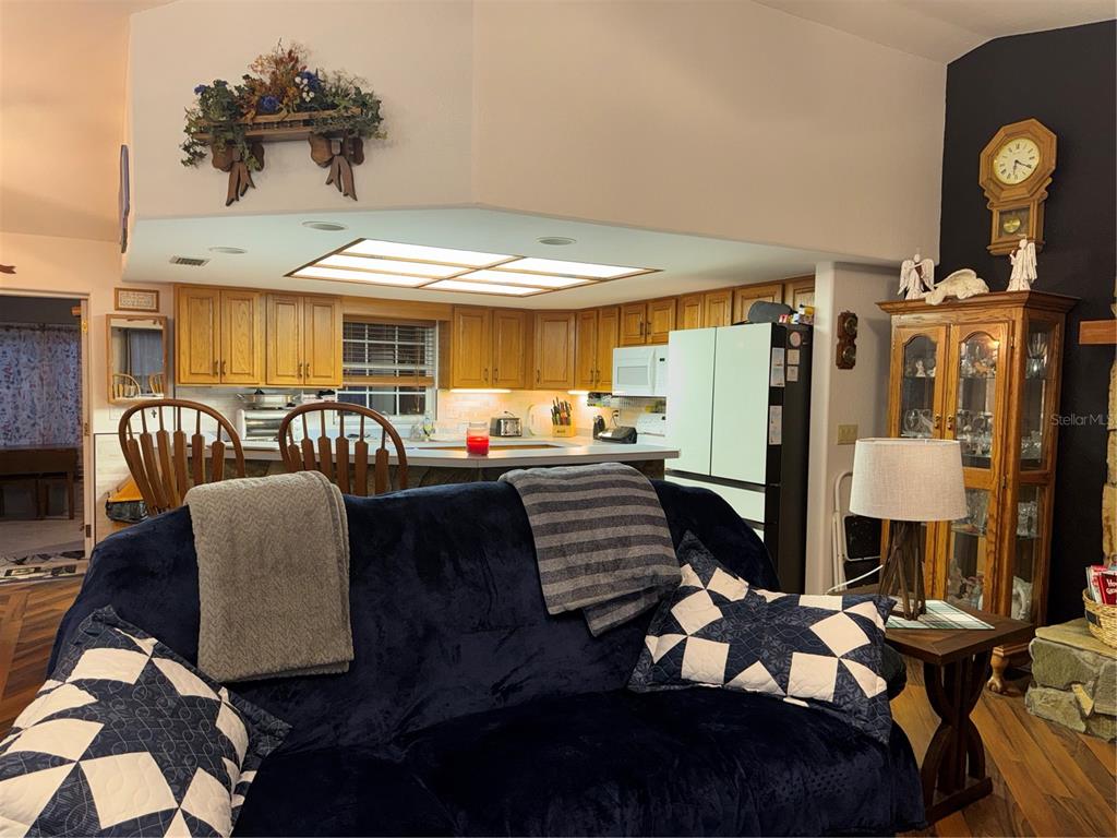 2134 R E Byrd Road Frostproof, FL 33843 - Photo 23 of 54 a living room with furniture and wooden floor