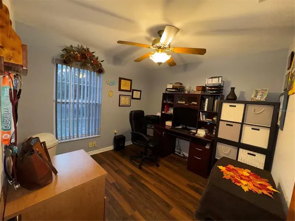 a bathroom with a granite countertop toilet sink and a mirror