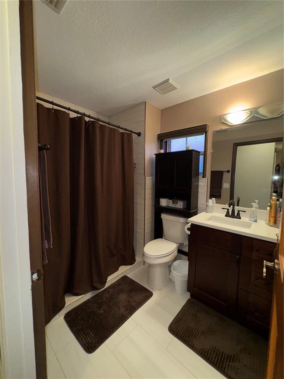 2134 R E Byrd Road Frostproof, FL 33843 - Photo 29 of 54 a bathroom with a sink toilet and shower