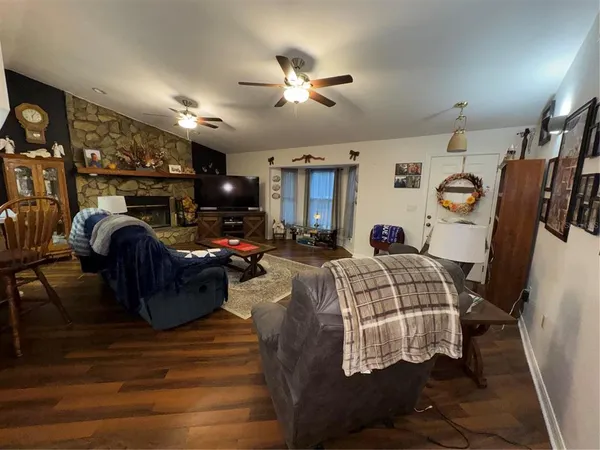 a bed room with furniture and a flat screen tv