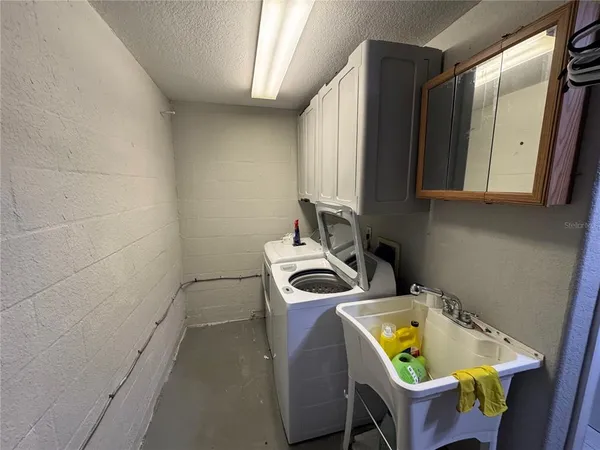 a white toilet sitting next to a bathroom sink