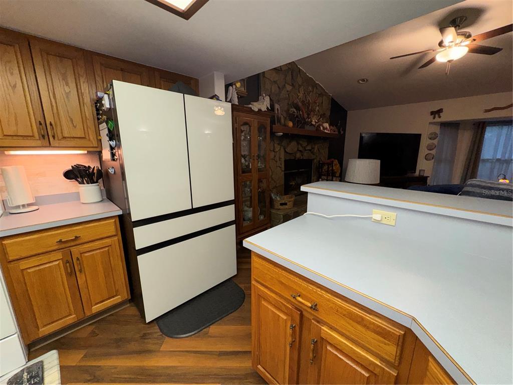2134 R E Byrd Road Frostproof, FL 33843 - Photo 6 of 54 a white refrigerator freezer and a stove sitting inside of a kitchen