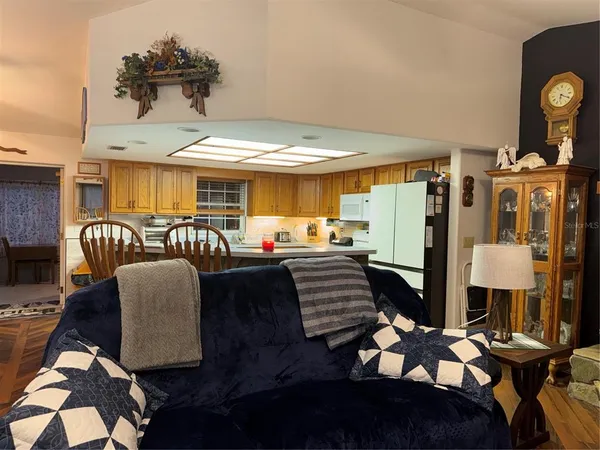 a living room with furniture flowerpot and a table
