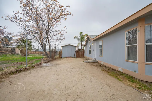 a view of a house with a yard and garage