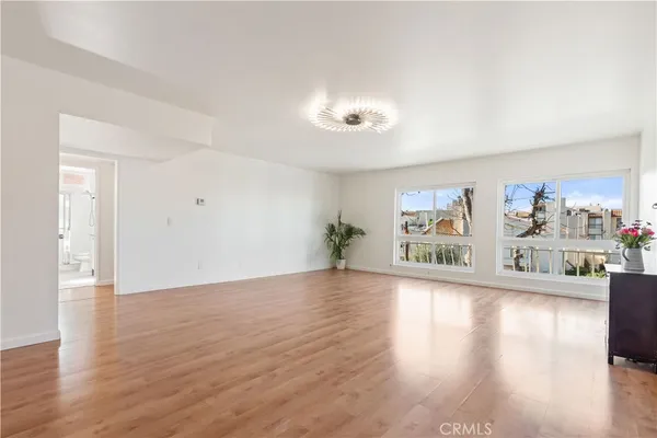 a view of a livingroom with wooden floor