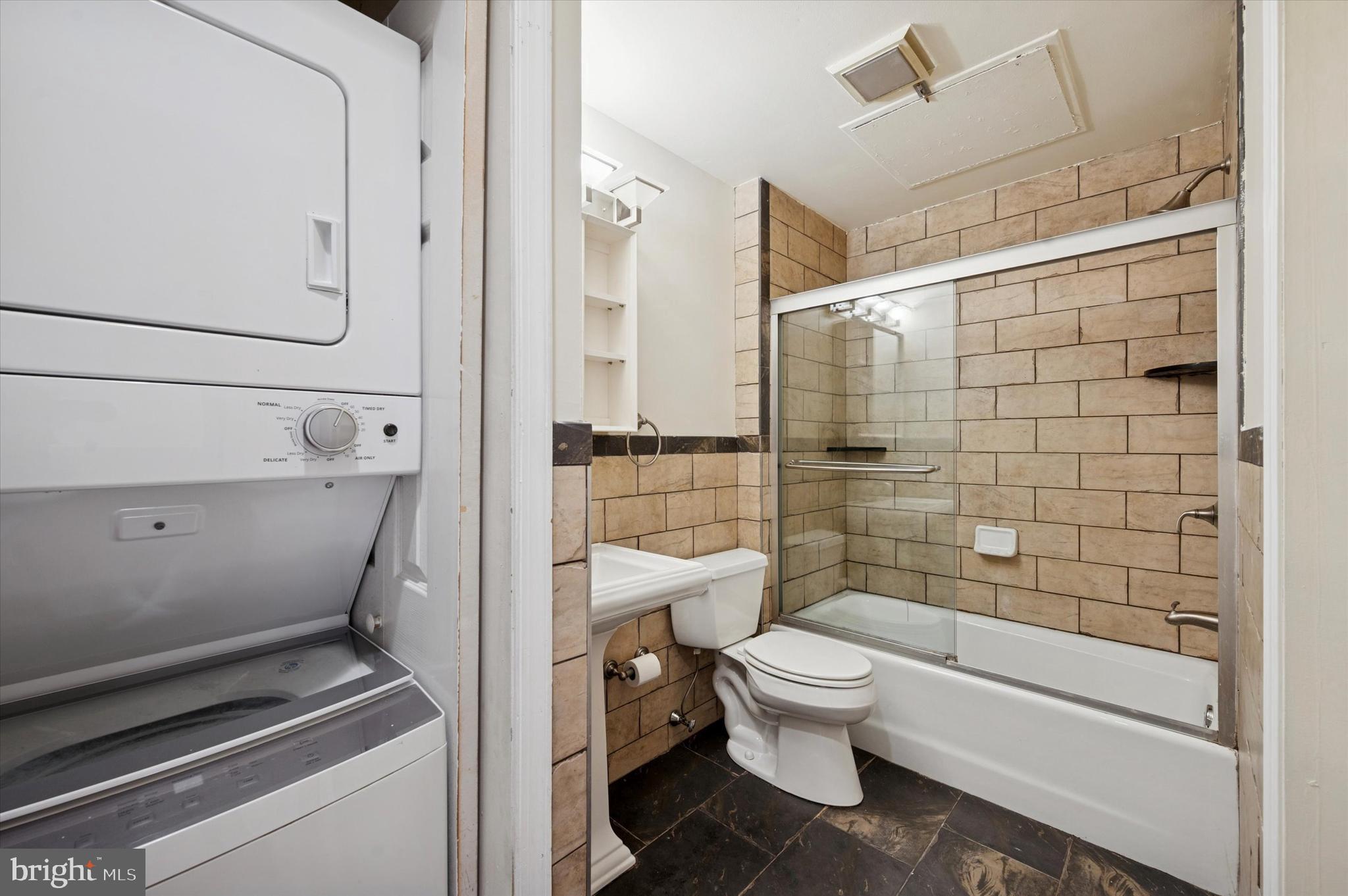 1601 Spring Garden Street, Unit 205 Philadelphia, PA 19130 - Photo 13 of 17 a bathroom with a toilet and a shower
