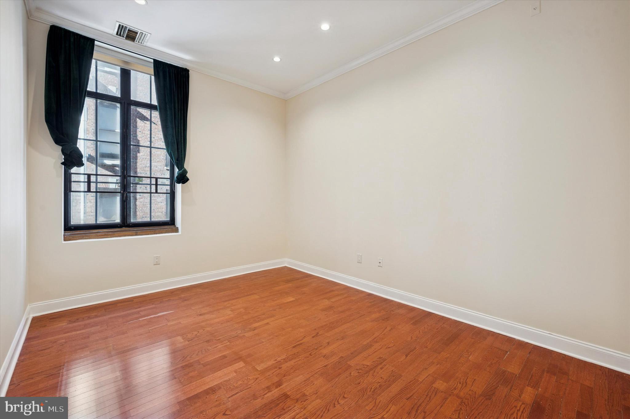 1601 Spring Garden Street, Unit 205 Philadelphia, PA 19130 - Photo 5 of 17 an empty room with windows