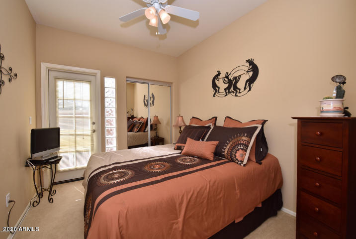 7641 East Indian Bend Road Scottsdale, AZ 85250 - Photo 11 of 19 a bedroom with a bed and furniture