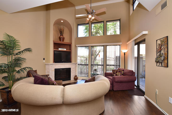 7641 East Indian Bend Road Scottsdale, AZ 85250 - Photo 2 of 19 a living room with furniture fireplace and flat screen tv
