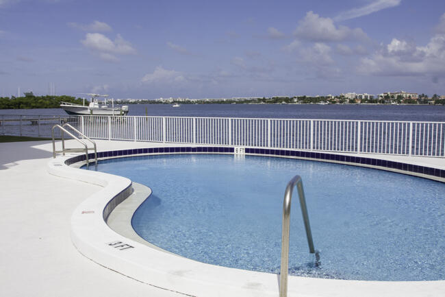 301 Croton Avenue, Unit 201 Lantana, FL 33462 - Photo 1 of 16 a view of a swimming pool with a lake