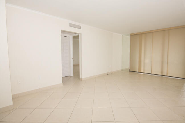 301 Croton Avenue, Unit 201 Lantana, FL 33462 - Photo 4 of 16 a view of an empty room and a window