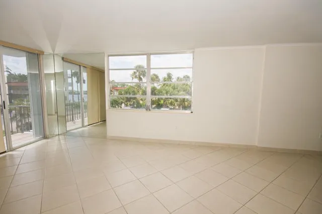 an empty room with entrance door