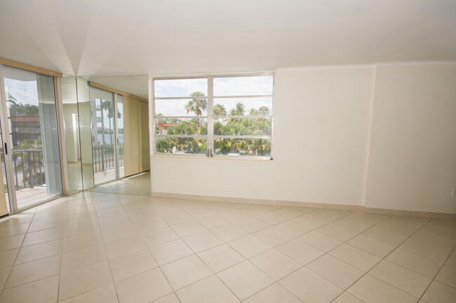301 Croton Avenue, Unit 201 Lantana, FL 33462 - Photo 5 of 16 an empty room with entrance door