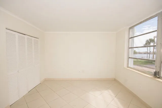 a view of an empty room with a window