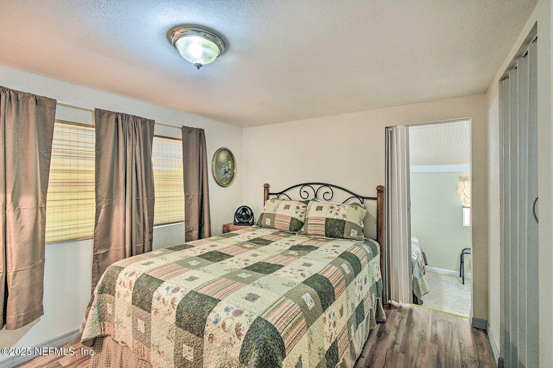 118 Riverside Avenue Satsuma, FL 32189 - Photo 13 of 27 a bedroom with a bed and a window